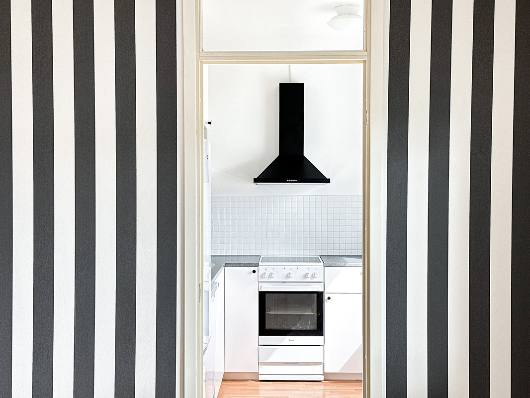 Ylimmän kerroksen tyylikkäästi remontoitu koti.